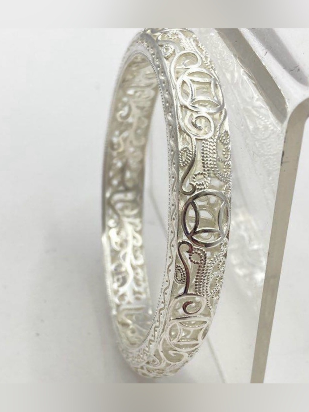 Detailed Chinese filigree bracelet, with lucky coin motif